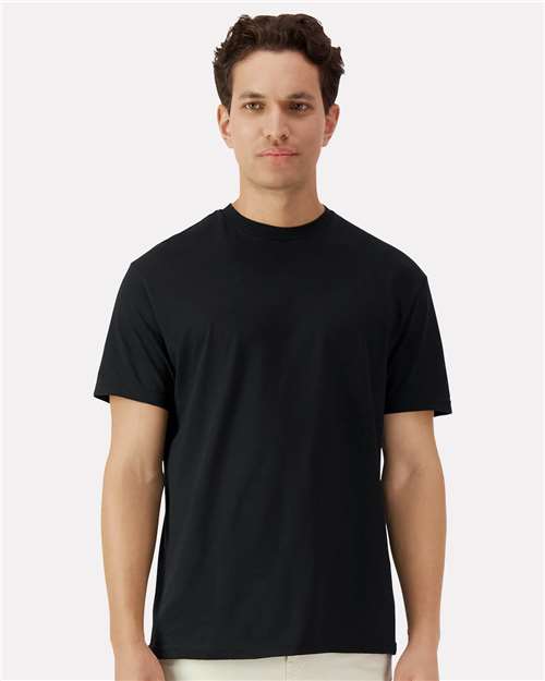Model wearing a Gildan 3000 Unisex Light Cotton T-Shirt in a neutral color, showcasing its casual design.