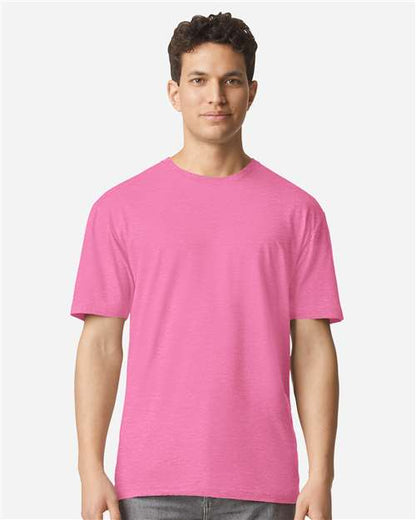 Model wearing a Gildan 3000 Unisex Light Cotton T-Shirt in a neutral color, showcasing its casual design.