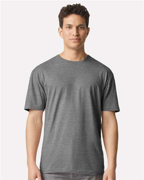 Model wearing a Gildan 3000 Unisex Light Cotton T-Shirt in a neutral color, showcasing its casual design.