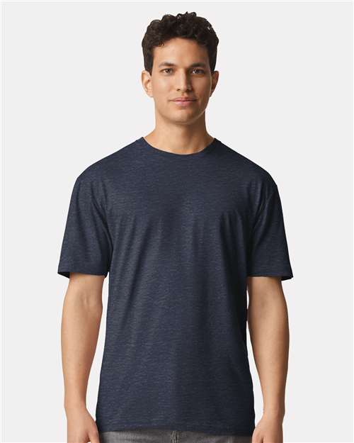 Model wearing a Gildan 3000 Unisex Light Cotton T-Shirt in a neutral color, showcasing its casual design.