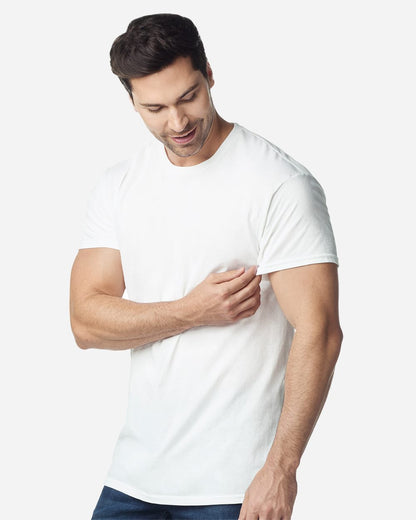 Model wearing a Gildan 3000 Unisex Light Cotton T-Shirt in a neutral color, showcasing its casual design.