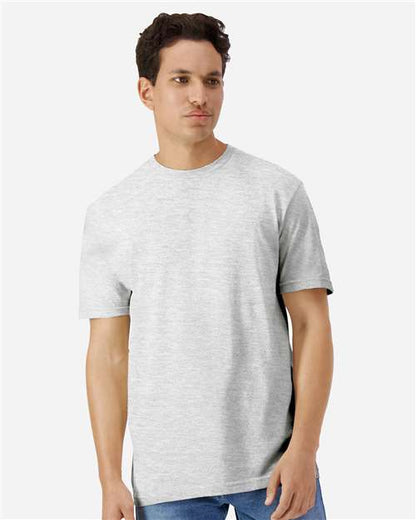 Model wearing a Gildan 3000 Unisex Light Cotton T-Shirt in a neutral color, showcasing its casual design.