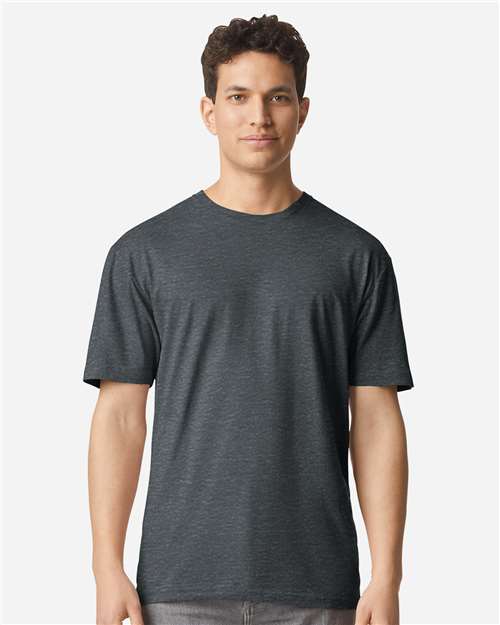 Model wearing a Gildan 3000 Unisex Light Cotton T-Shirt in a neutral color, showcasing its casual design.