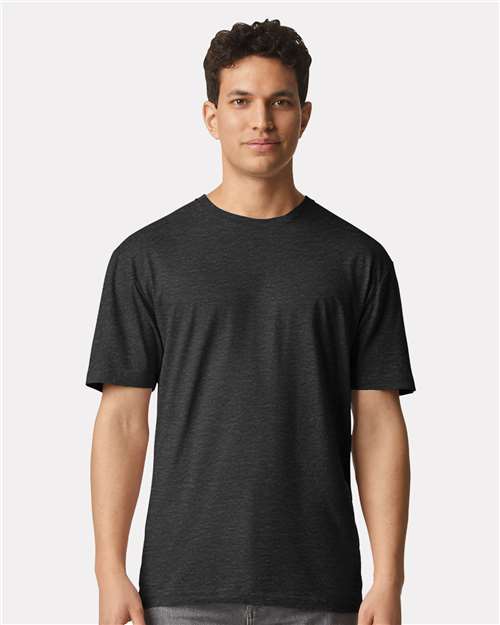 Model wearing a Gildan 3000 Unisex Light Cotton T-Shirt in a neutral color, showcasing its casual design.
