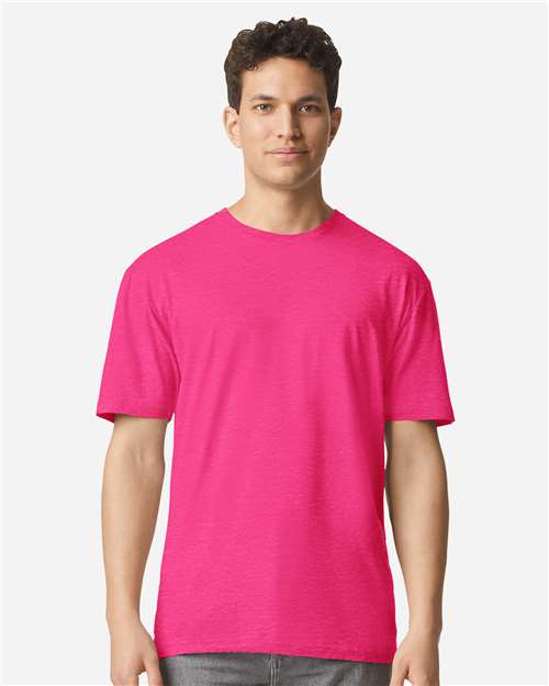 Model wearing a Gildan 3000 Unisex Light Cotton T-Shirt in a neutral color, showcasing its casual design.